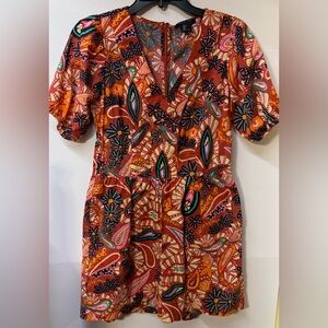 Rachel Zoe Vibrant Floral Romper in Rust Orange and Pink.
